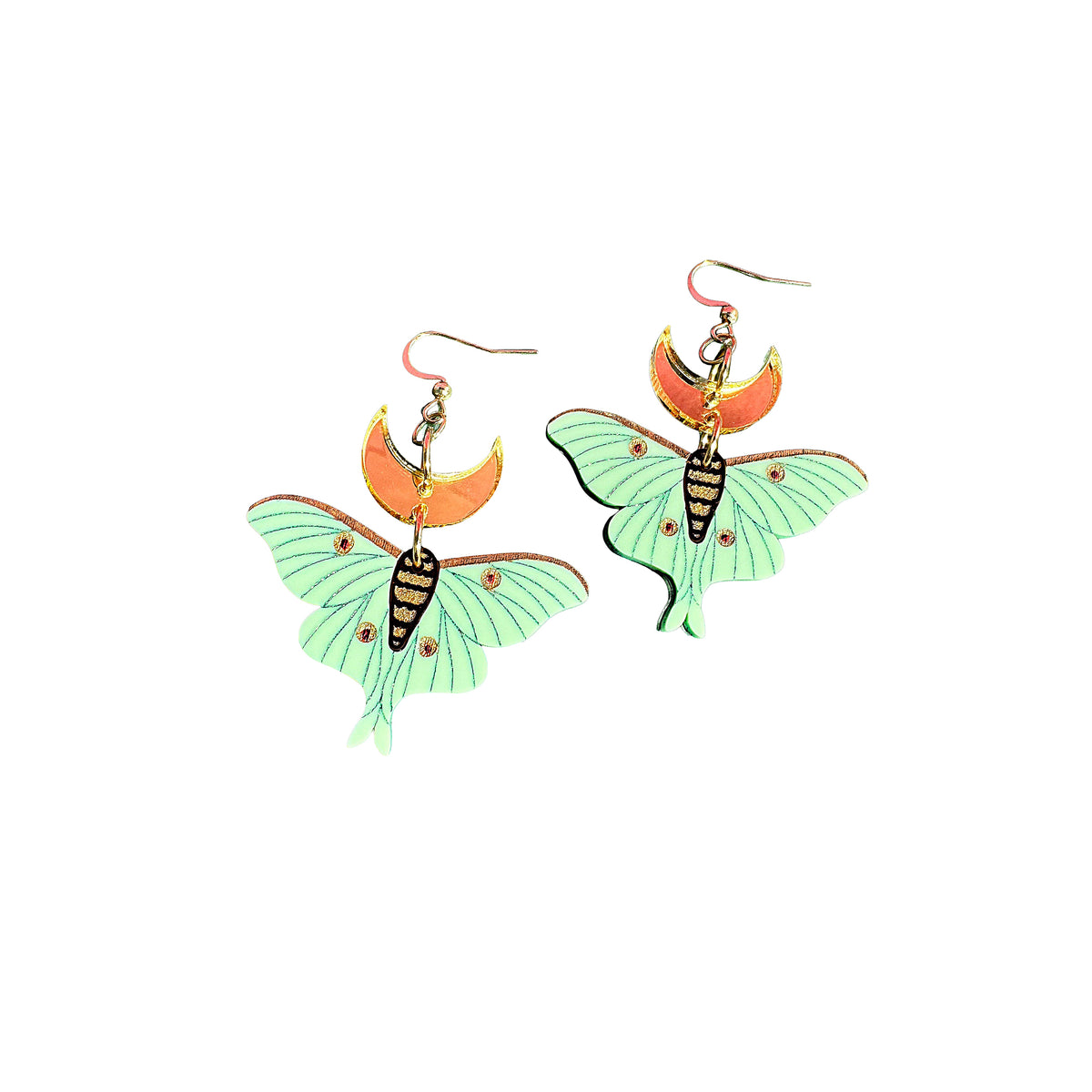A pair of dangling earrings shaped like luna moth wings, with mint green wings, orange crescent moons, and black-and-gold striped bodies, shown on a plain white background.