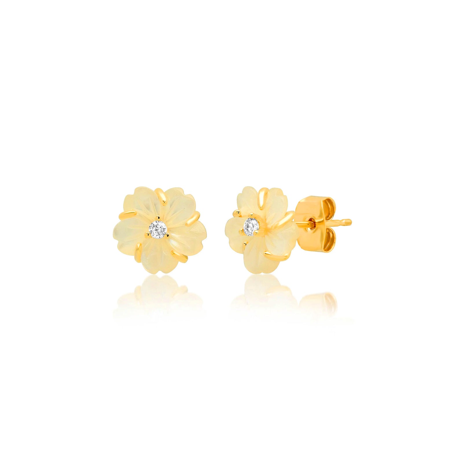 A pair of gold flower stud earrings, each featuring a small clear round-cut gemstone at the center, displayed on a clean white background with a soft reflection underneath.