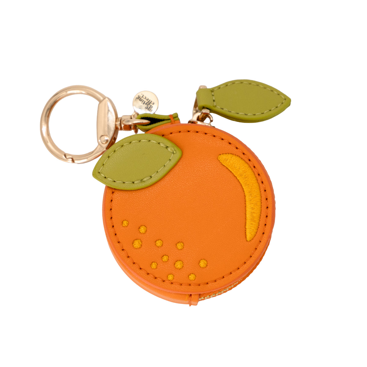 Orange-shaped keychain with green leaves on a white background