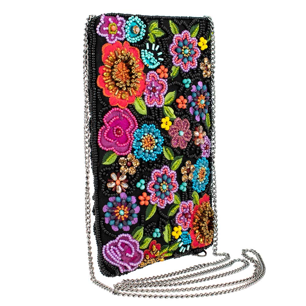 Feel the power of the flower with this stunning beaded crossbody phone purse. The enchanting flower design is accented with an array of colorful shimmering beads and rhinestones, giving this bag a touch of glamour. 4.75" x 0.5" x 7.75". This is a handmade item, each one an individual work of art. 