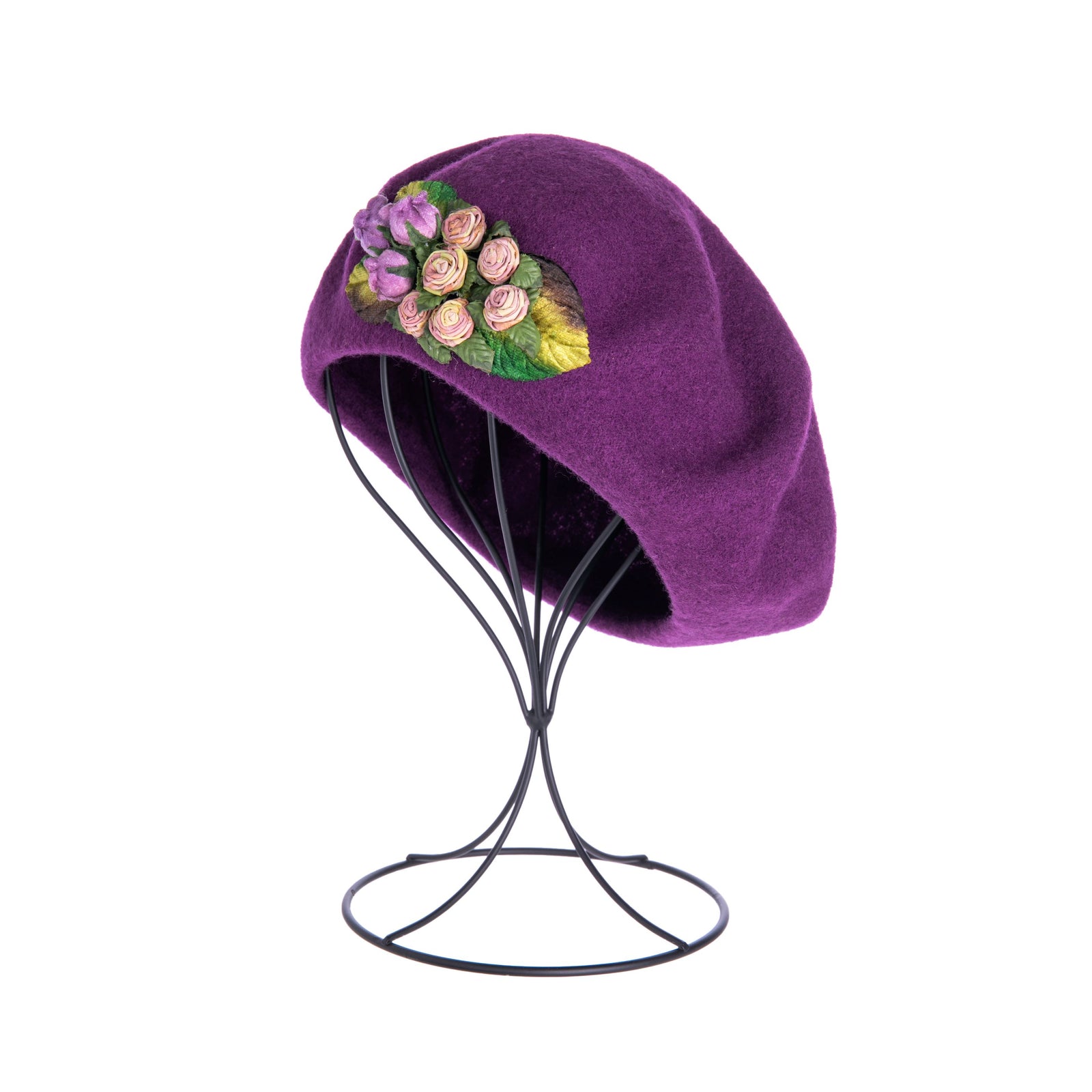 This classic, all-wool beret is trimmed with silk and velvet flowers, accented by leaves in rich, tonal colors. Instantly add a little Parisian chic to your outfit with this must-have accessory. It will quickly become your go-to hat for chilly temperatures or days when you need to add a touch of elegance to your look. 