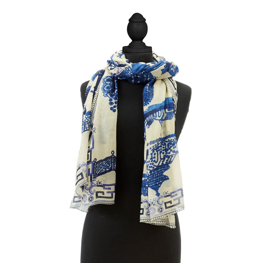 This elegant giant willow scarf has a neutral background and an intricate design. Pairs well with solid colors and is a fantastic topper for a plain white tee & jeans. Features pagodas, birds and willow tree design throughout. Super soft. 40" W x 78" L Made from a custom blend of 50% Modal & 50% Viscose. Hand Wash.