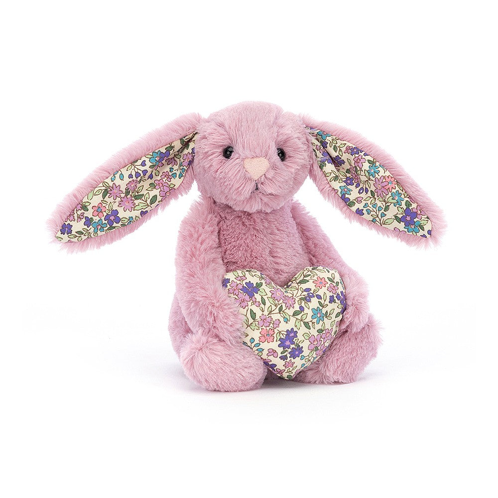 Blossom Heart Tulip Bunny is a cottagecore cutie in scrumptious berry fur. Chill and charming, this hopping honey has ditsy-print ears and a matching snuggly heart. Say thank you, I love you or I know you dig bunnies with this fabulous fuzzy-tail friend. H6" X W3".  Suitable from birth. Hand wash only.