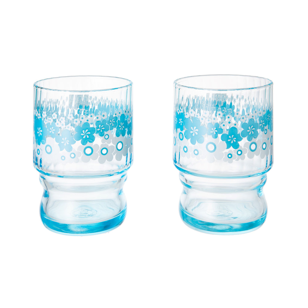 These beautifully blossomed handmade glass cups are made in Japan by artisan glassmaker Aderia. This retro glassware adds the perfect finishing touch to any table setting, and can be used to serve iced water, or something a little stronger! Measures approximately 2.5 x 4 inches. Set of two glasses. Crafted in Japan.