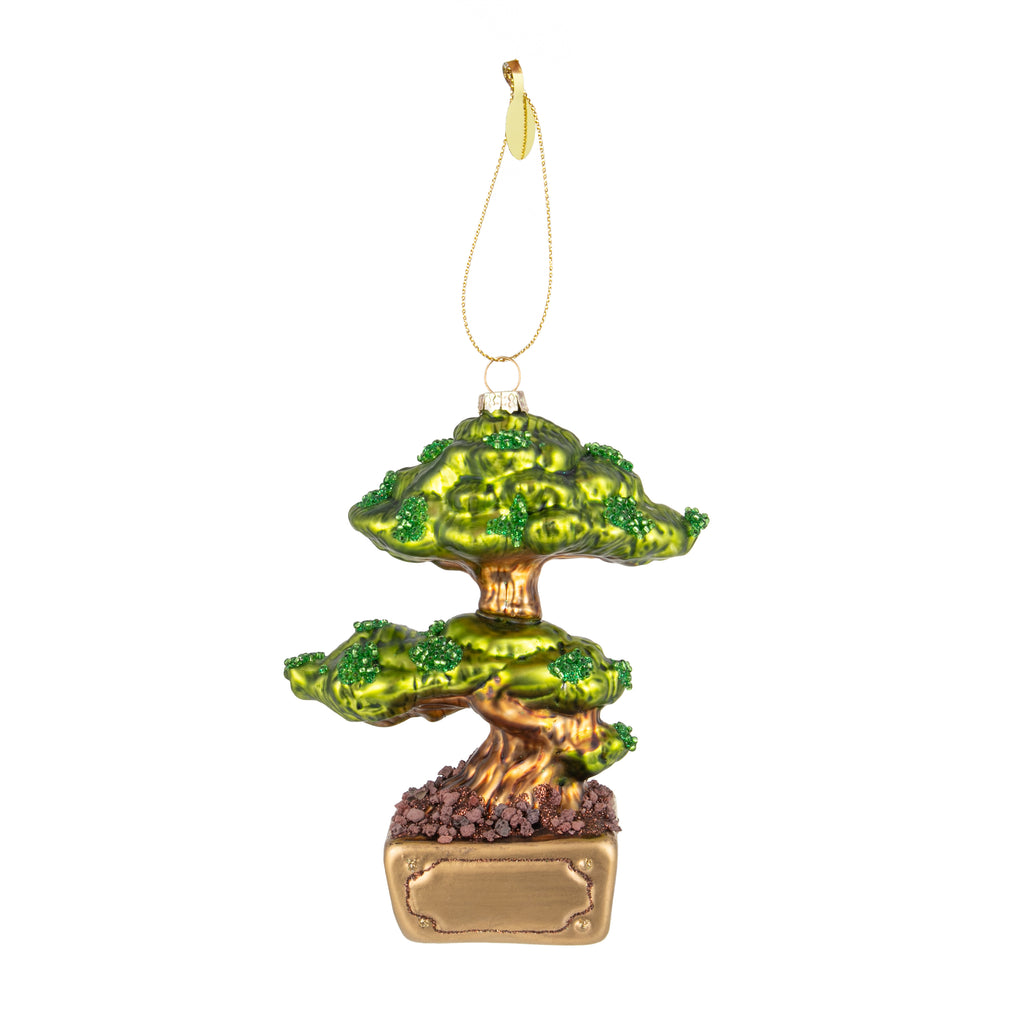 Love Bonsai but don't quite have the time to wait? Then our beautifully detailed Bonsai tree ornament is the answer! With its iconic Bonsai shape, highlighted with sparkles, set in a classic rectangular pot with life-like gravel, this terrific tree will add a touch of Zen to your decor.  Size approx 6" x 4"