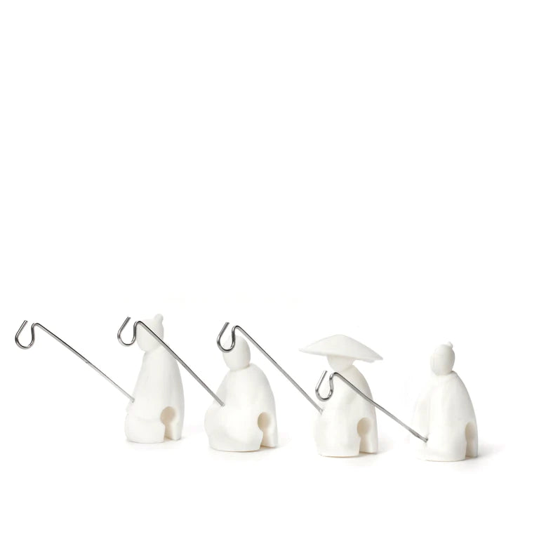 These tea holders are based on an old Chinese story of Jiang Taigong. He uses a straight fishhook because he believed that the fish will come to him when they were ready to be caught. Now he can hold your tea bag! Set of 4 fishermen. Made of silicone - attaches to your cup or mug. Each fisherman is approx 1&quot; x 0.5&quot;.