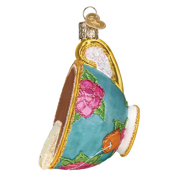 Any time is tea-time with this charming tea-cup shaped ornament. Glass ornament with hand-finished details. Gold cord for hanging. Size approx 4" x 2".