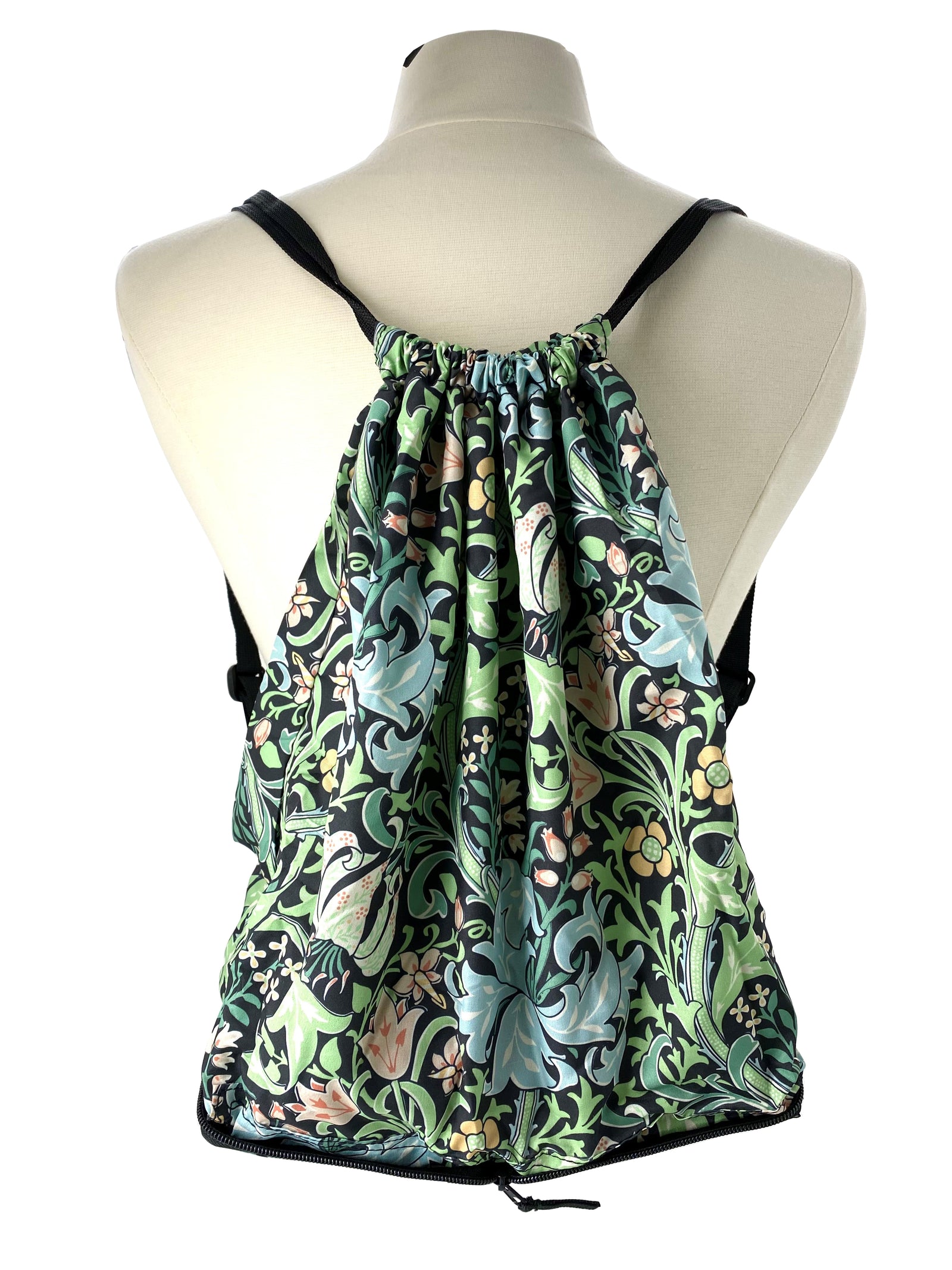 A beautifully designed backpack custom made for The Huntington based on William Morris's Golden Lily, held in The Huntington's Art Collections. This handy backpack folds up into a 5 x 4 ½ x 2” parcel and can be thrown into your purse when heading to the farmers market, a hike, & more. 16" x 14" x 4.5" when unpacked.