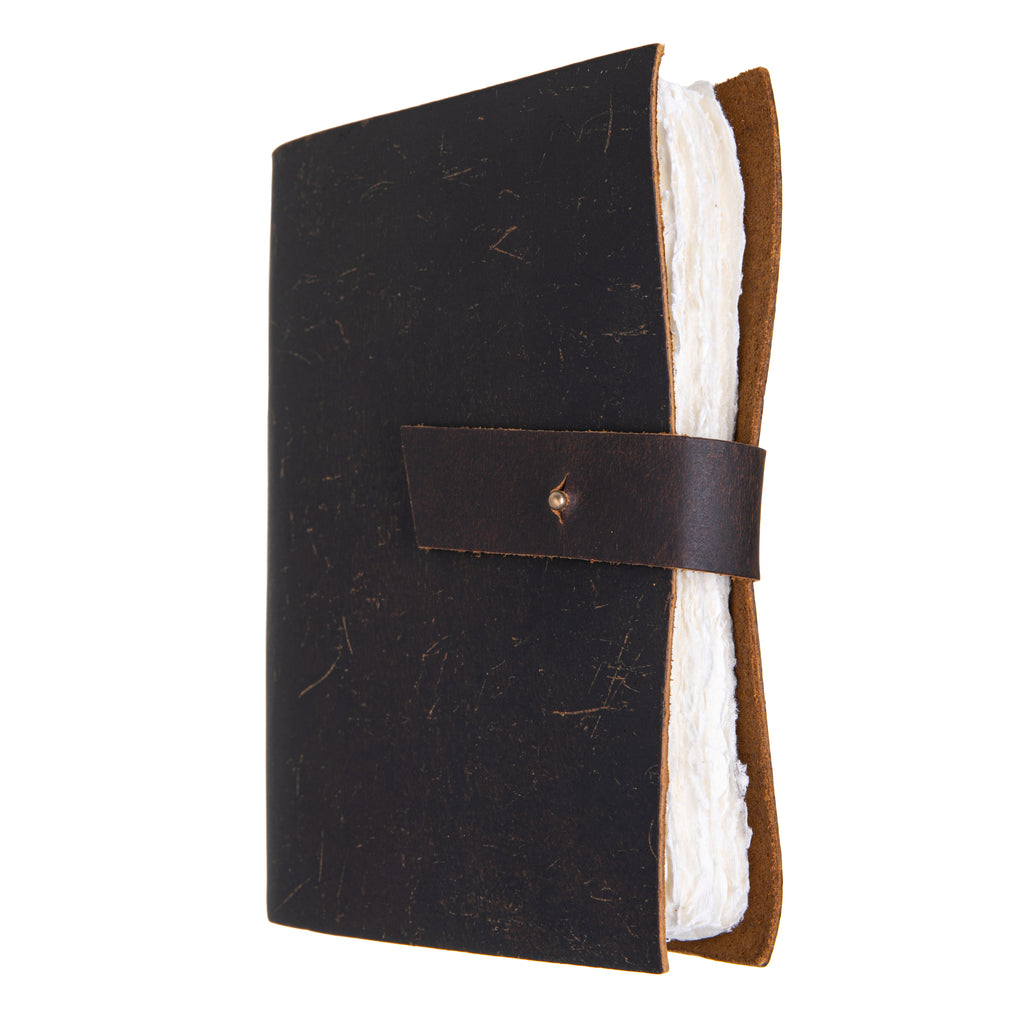Write your own fairytale, or jot down your secrets and musings in this enchanting, extra large leather bound blank page journal. The paper within the journal is hand made, with an un-trimmed, rustic edge. Fastens with a vintage-style metal stud. Each journal is hand made, and therefore, unique. Size: 12" x 9".