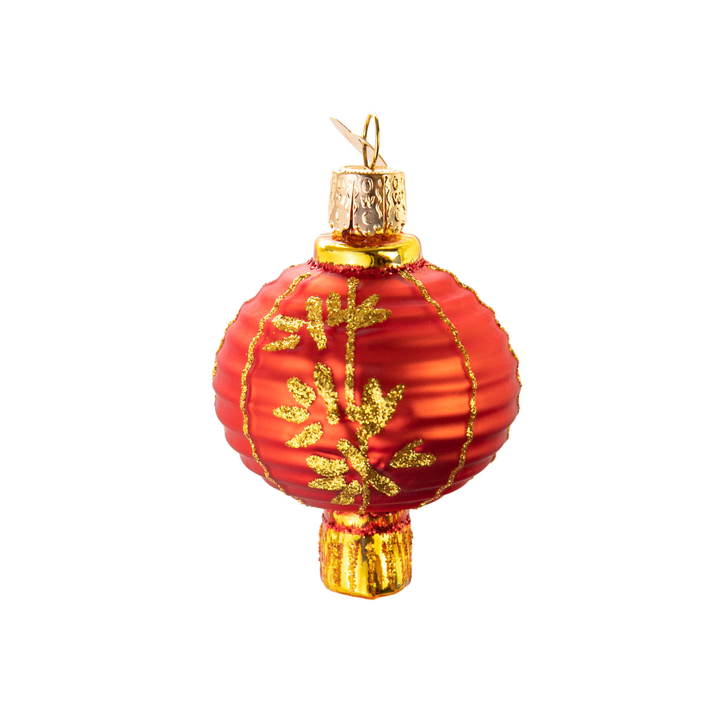 A true work of art and engineering, Chinese lanterns are made of brightly colored paper or silk, most commonly red, and are used for decoration in many different occasions.  Glass ornament Hand-painted Hand-glittered Size approx 2" x 3".