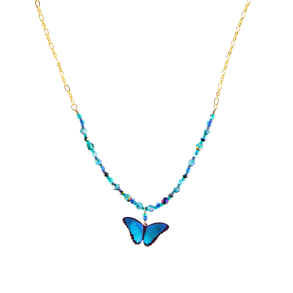 Add a flutter of irridescent color to your look with this stunning blue butterfly necklace. Hand threaded accent beads compliment the butterfly charm. • Niobium • Gold filled chain • Chain length 16", adjustable to 18"