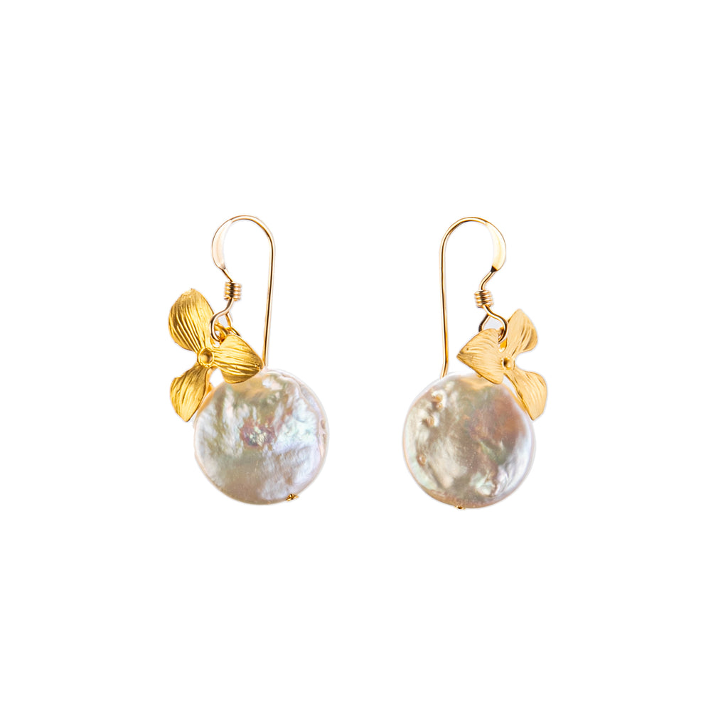 The timeless pairing of gold and ivory pearl feature in these ultra elegant coin-drop earrings, featuring a gold-dipped orchid petal charm. 14k gold filled French wire 16k gold dipped carved orchid petal charm detail Hand wrapped white freshwater coin pearl