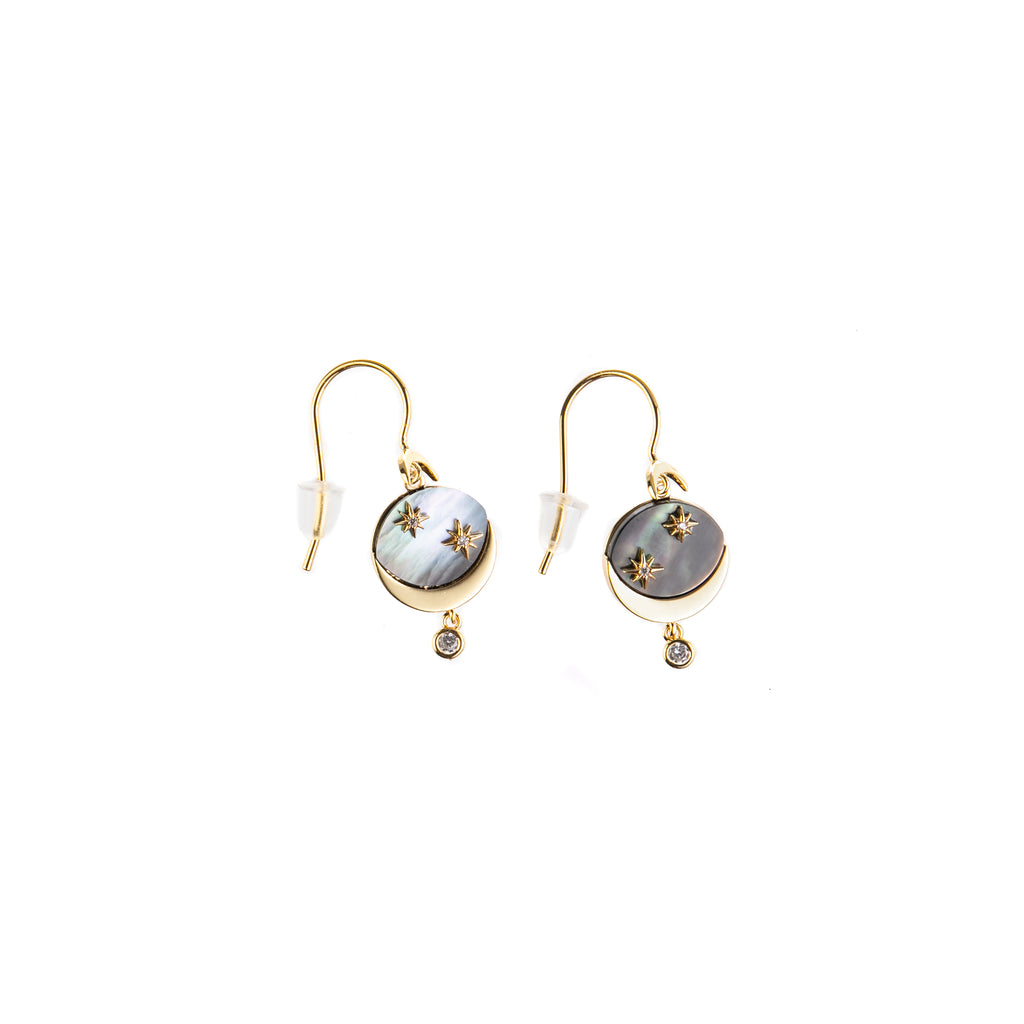 From morning to night, these celestial earrings will add a touch of cosmic sparkle to your look. Featuring a pearly shell inlay and golden stars, these earrings are accented with cubic zirconia stones. Gold-plated brass earrings. Gold-filled ear wires Size: approximately 0.5".