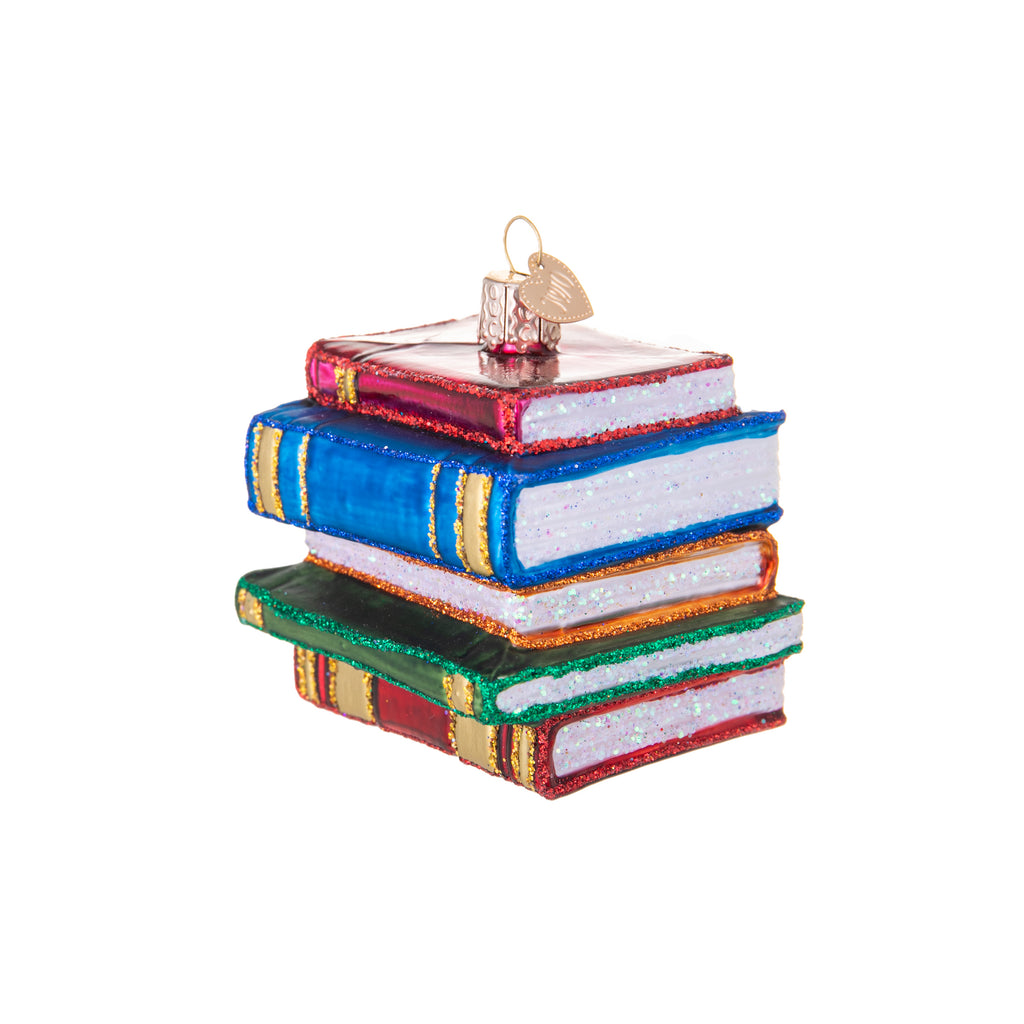 Perfect for the book lover in your life. Let this ornament serve as a reminder of how books spark our imaginations and provide multitudes of enrichment. Mouth-blown glass Delicately hand-painted and glittered 2 1/2 inches high.