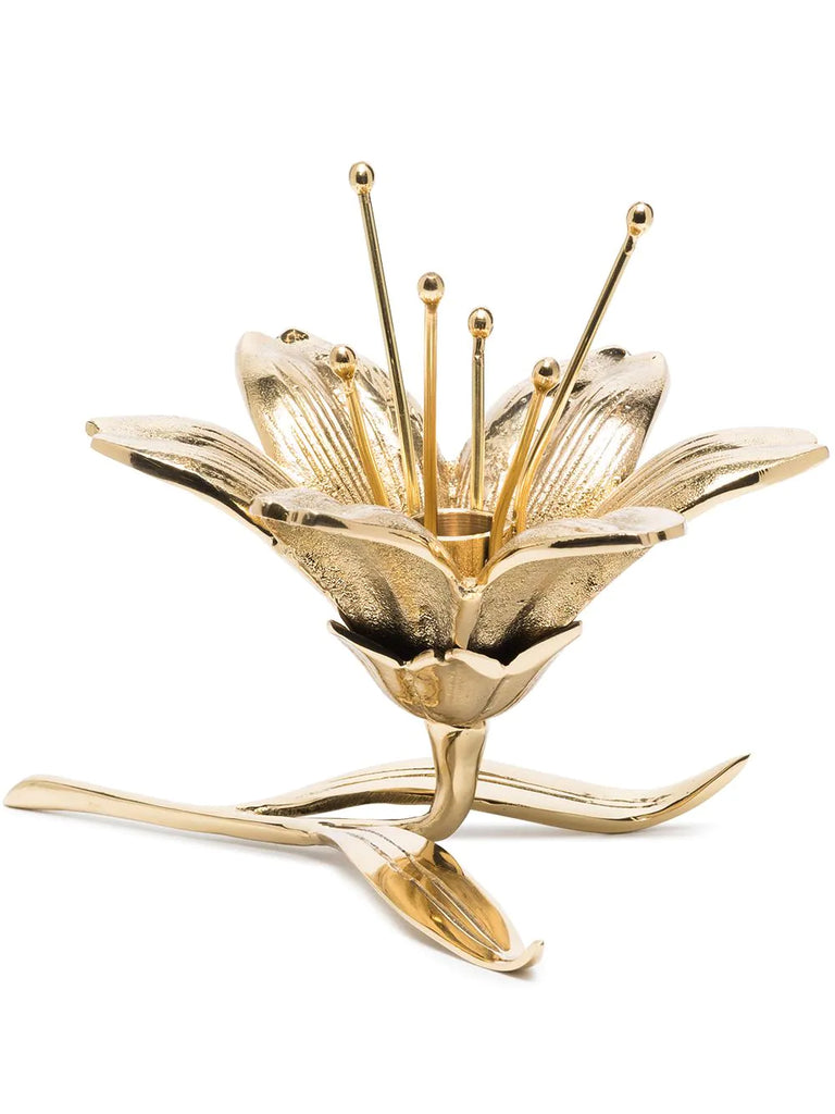 A real Lily was used to create the mold for Pols Potten's floral candle holder. The result is a piece that captures all the natural beauty of this stunning flower in a gorgeous, high quality metal candle holder. Material: Plated aluminum with lustrous gold finish Made by Pols Potten. Size: Height 6". Width 7".
