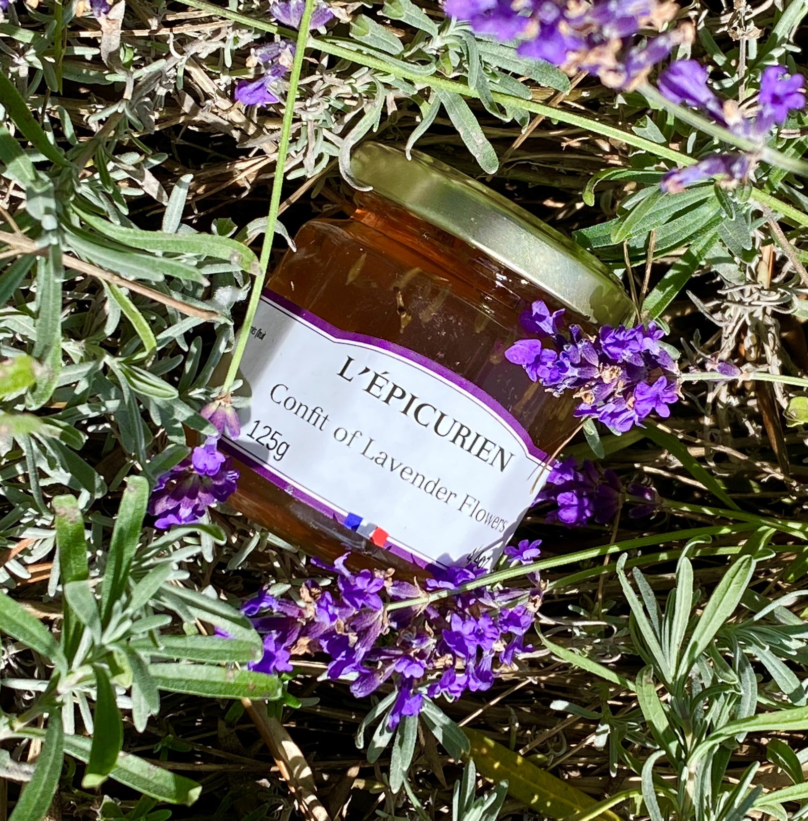 Made with the highest quality ingredients, this confit is the true taste of Provence, France. Can be mixed with cream, yogurt, ice cream, or even paired meat or cheese. Ingredients: Cane Sugar, Water, Grape Sugar, Lemon Juice, Fruit Pectin, Calcium Citrate, Lavender Flowers (0.18%), Natural Lavender Aroma France 4.4 oz
