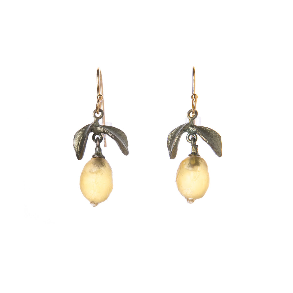 These lemon drop earrings were developed in collaboration with the Victoria & Albert Museum in London. This collection was inspired by the V&A’s Green Dining Room, the world’s first museum café, and its fruit panels designed by William Morris. Hand patinated bronze with glass. 24k gold plated ear wires 1 1/4" x 1/2".