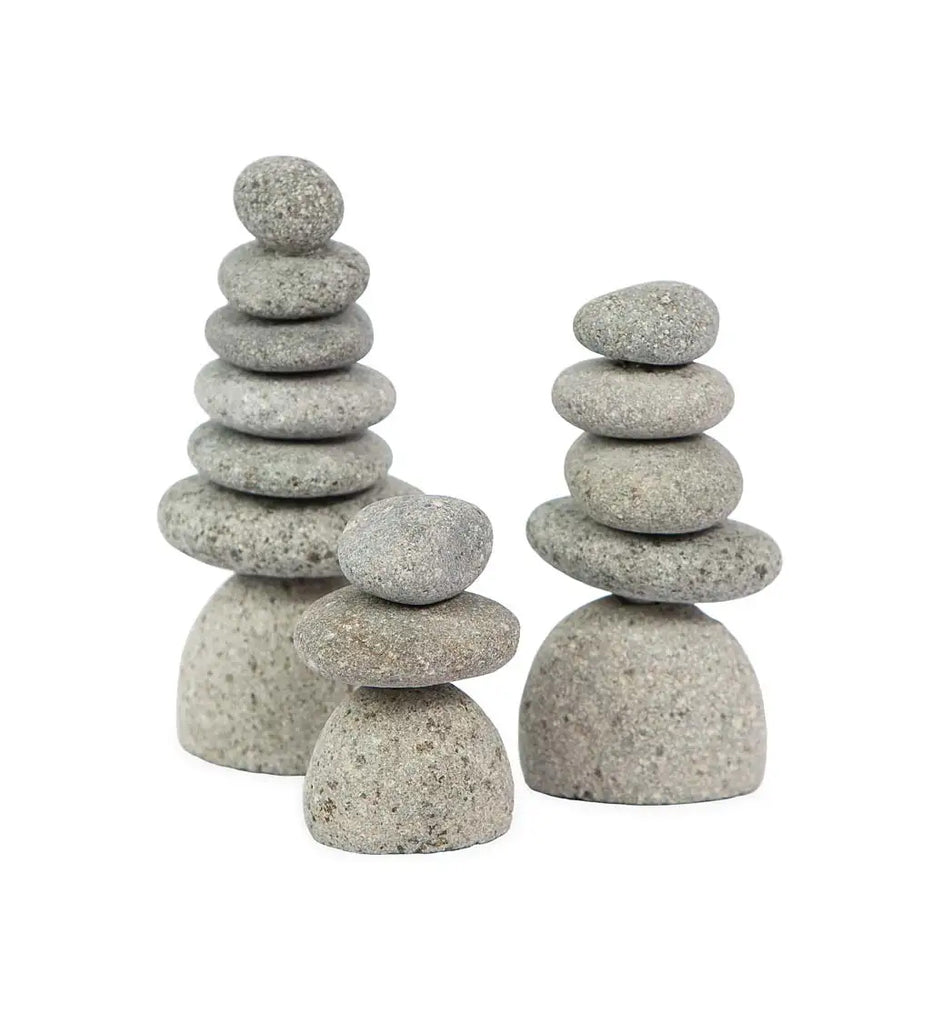 Bring the serenity of Zen cairns indoors to your workspace, desk or home with this set of three miniature Rock Cairns. Cairns have appeared all over the world since ancient times. They represent hope, safety, and guidance. Set includes three stacked cairn sculptures. 2.5"Dia x 3.25"H Fairtrade. Handcrafted in Indonesia