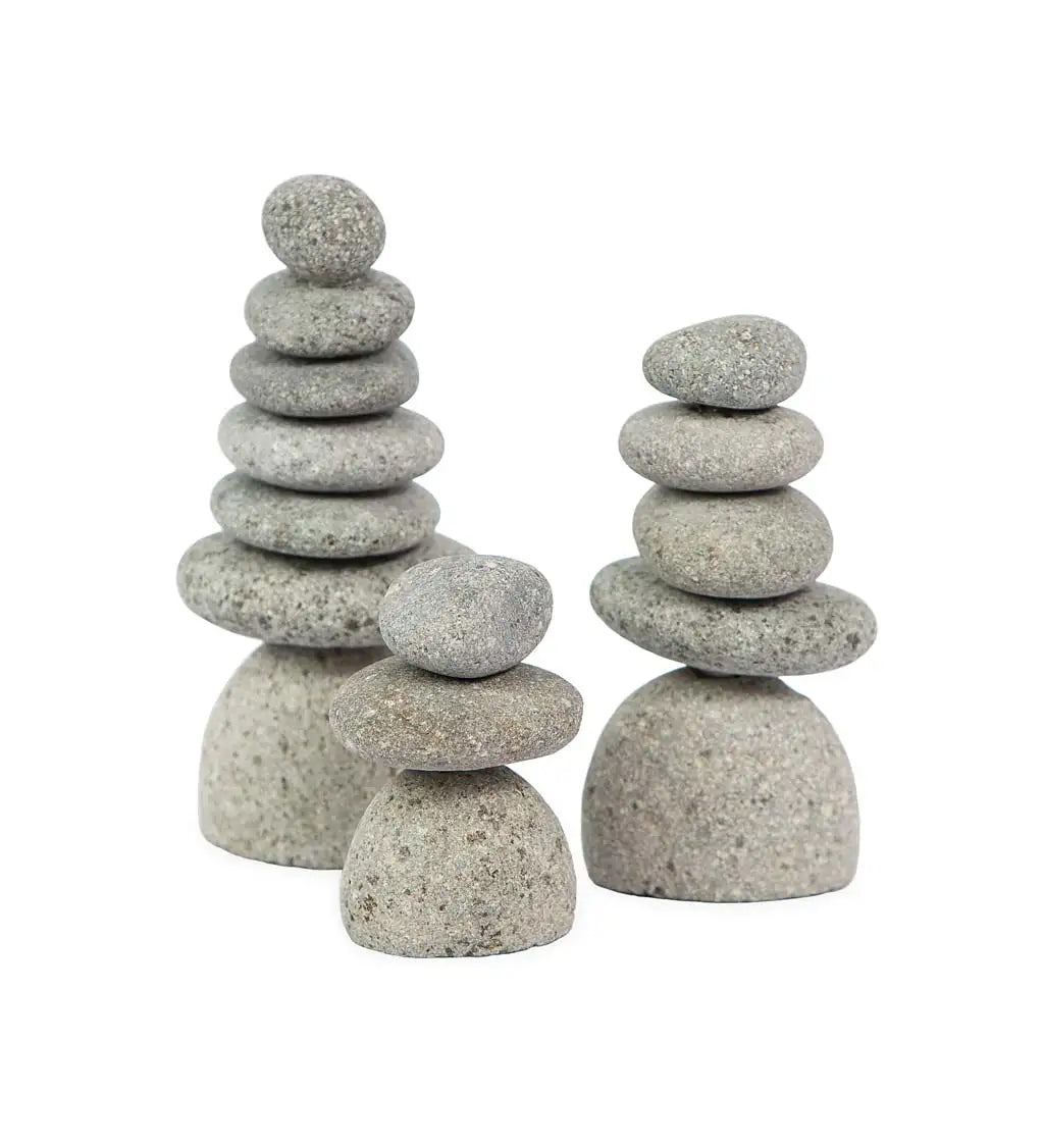 Bring the serenity of Zen cairns indoors to your workspace, desk or home with this set of three miniature Rock Cairns. Cairns have appeared all over the world since ancient times. They represent hope, safety, and guidance. Set includes three stacked cairn sculptures. 2.5&quot;Dia x 3.25&quot;H Fairtrade. Handcrafted in Indonesia
