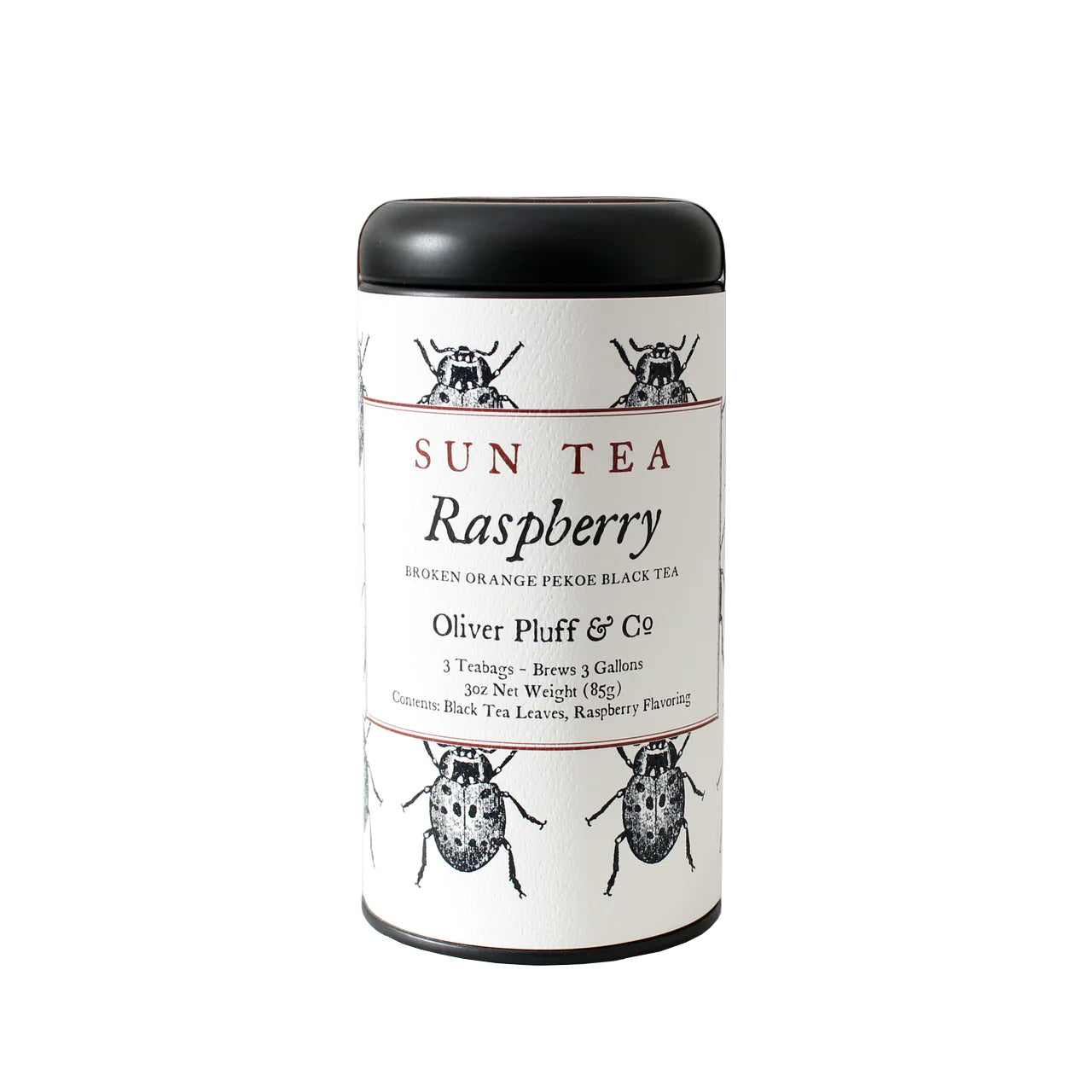 A cylindrical metal tin packaging for Oliver Pluff & Co Raspberry Sun Tea with illustrations of raspberries and tea leaves, and text detailing the product as Sun Tea Raspberry with 'brews 3 gallons' note.