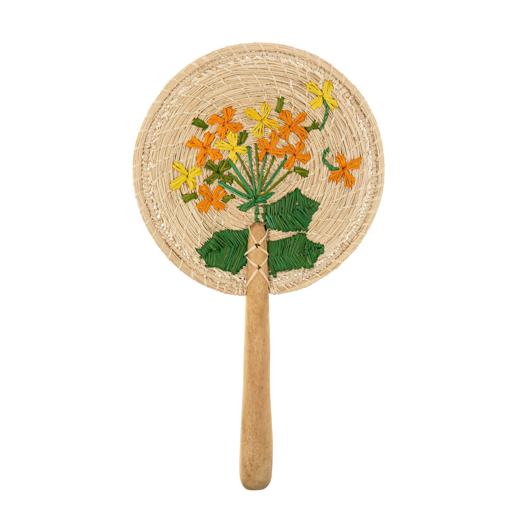 This beautiful paddle-style fan was hand woven and embroidered in Usiacuri, Columbia. Both the fan, and the embroidered details are made from natural dried iraca palm leaves, with a natural wood handle. Hand made in Columbia. Fair trade. Fan circumference: 6.5" Fan length: 11".