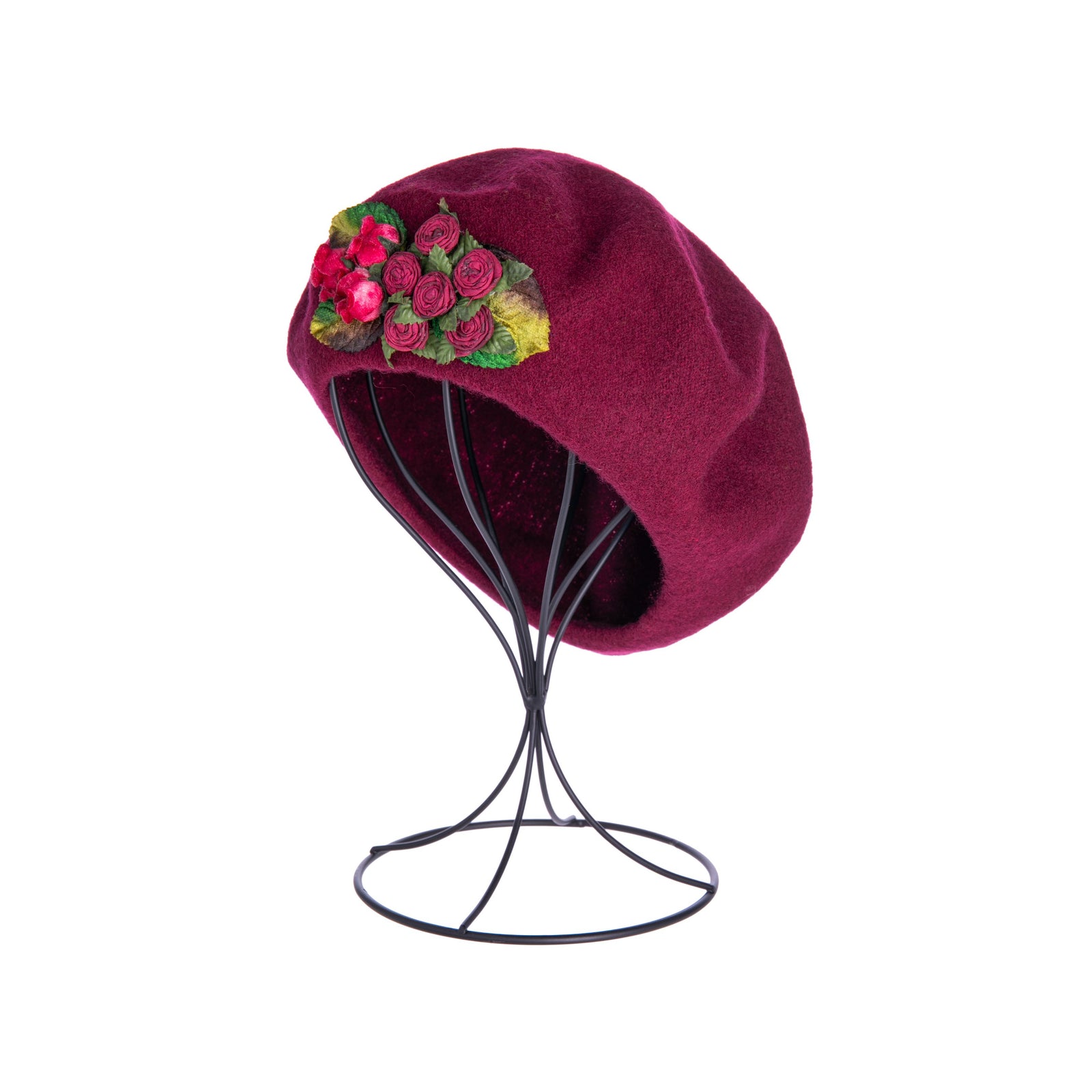 This classic, all-wool beret is trimmed with silk and velvet flowers, accented by leaves in rich, tonal colors. Instantly add a little Parisian chic to your outfit with this must-have accessory. It will quickly become your go-to hat for chilly temperatures or days when you need to add a touch of elegance to your look. 