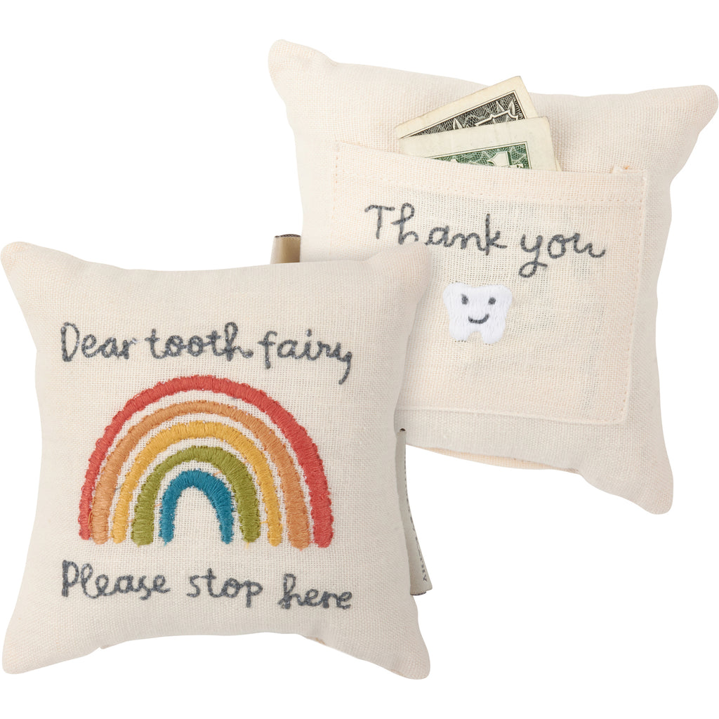 A cotton-linen blend pillow displaying a fun rainbow design with "Dear Tooth Fairy Please Stop Here" sentiment. Pillow features pocket on the back to hold tooth or tooth fairy reward with a happy tooth design and "Thank You" sentiment. Designs and sentiments are embroidered for added interest. Dimensions:5" x 5".