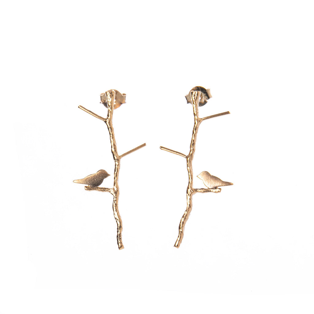 These whimsical, elegant post earrings feature a delicate twiggy branch with a sweet little bird perched at the bottom. A perfect gift for any nature lover or birdwatcher. 14k gold plated. Stirling silver post fastening. Made in California.