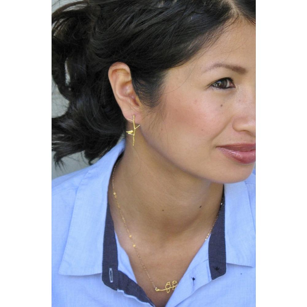 These whimsical, elegant post earrings feature a delicate twiggy branch with a sweet little bird perched at the bottom. A perfect gift for any nature lover or birdwatcher. 14k gold plated. Stirling silver post fastening. Made in California.