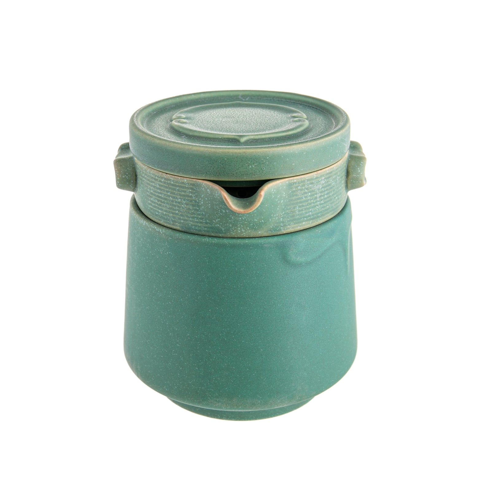 A set of emerald green ceramic tea infuser, cup, and lid.