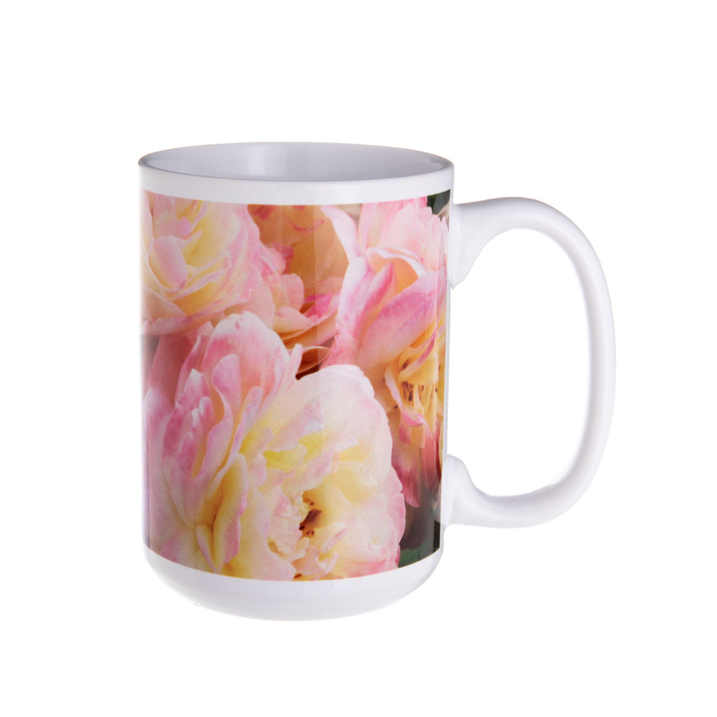 Ceramic mug featuring the 'Huntington's 100th' rose. In celebration of the centennial of The Huntington, this rose is a spectacle of pastel yellow with a kiss of pink and cream. Hybridized by Tom Carruth, The Huntington's Curator of the Rose Collections. Exclusive to the Huntington Store Size: 4.5" tall. 3.5".