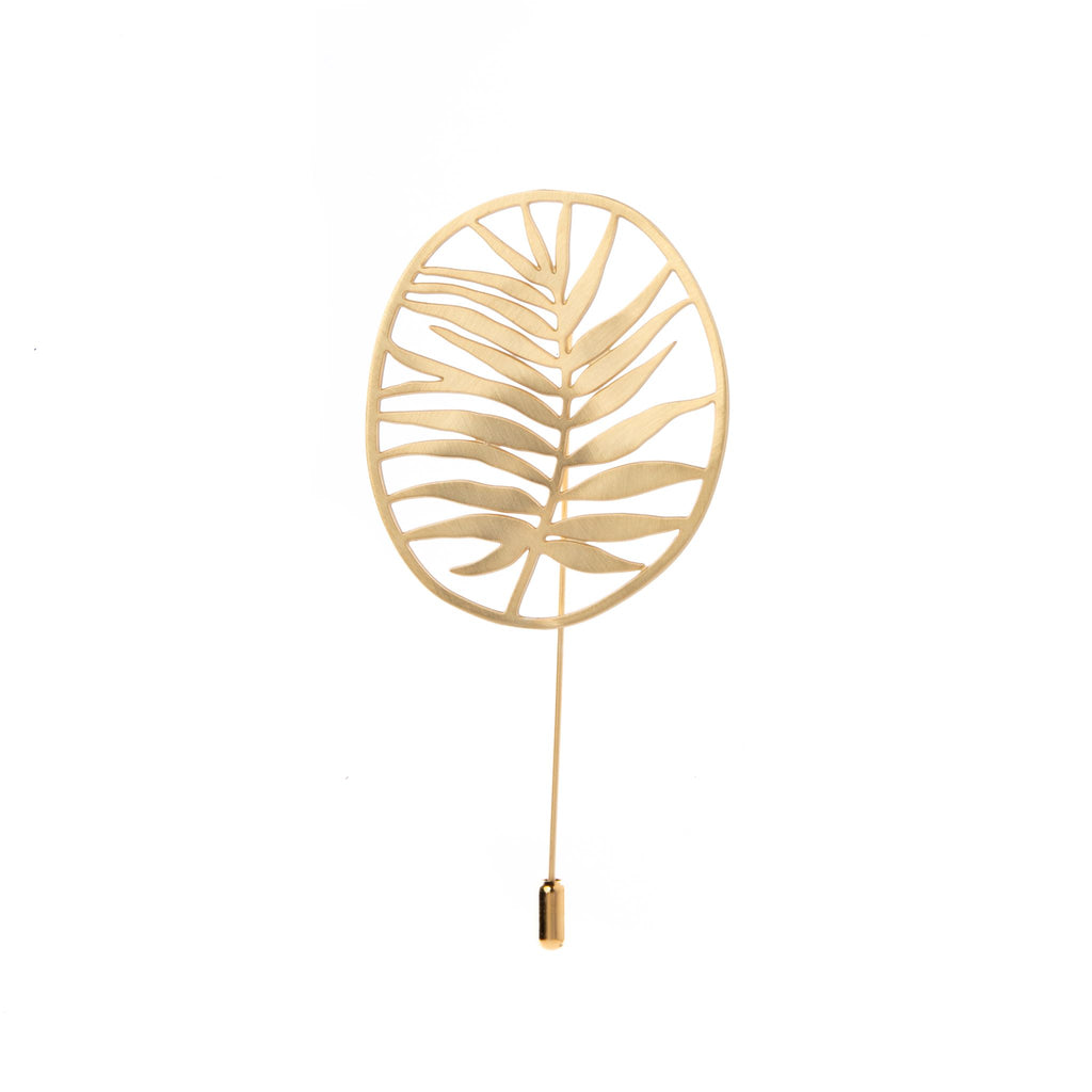 Add a touch of tropical elegance with this statement leaf pin. Pin to hats, clothing, purses and more! Material: brass with brushed gold-plated finish Pin size: Length 4" x width 2" Made in Spain. Matching earrings and necklace available.