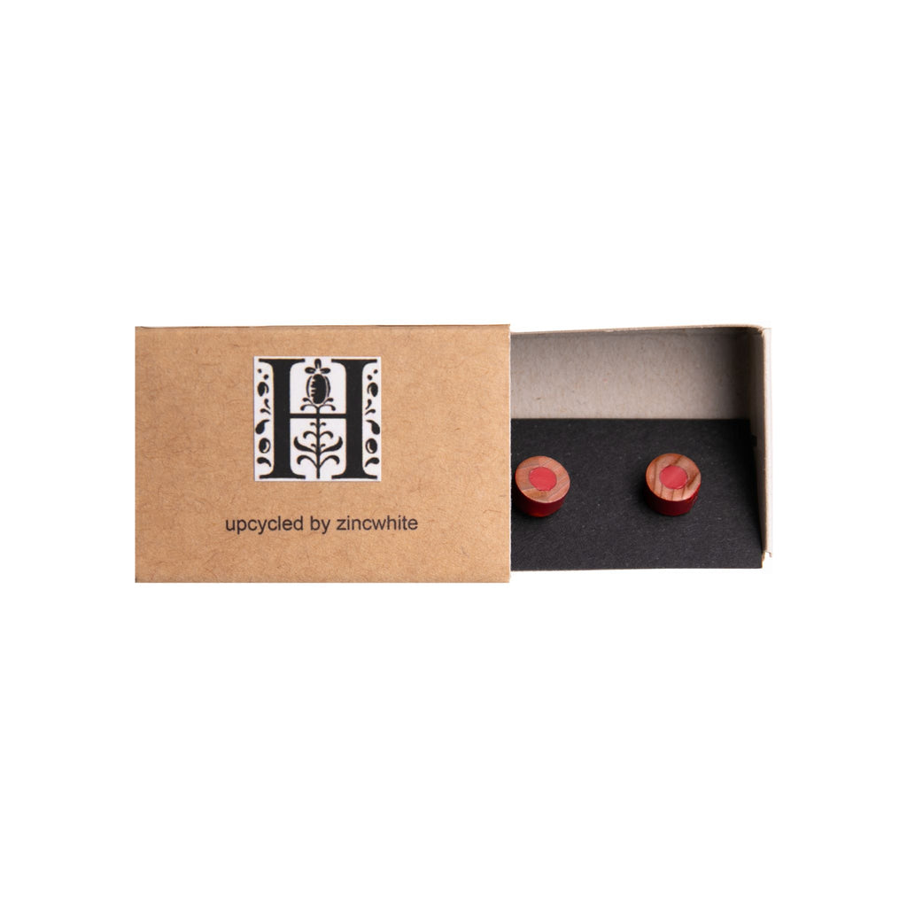 These conversation-piece stud earrings have been made using recycled red coloring pencils from the Derwent Pencil Factory in Cumbria, England. Sterling silver posts 8mm diameter Hand made - each pair is unique and may differ slightly from the photo