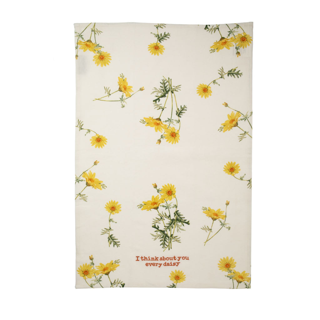 A cotton linen blend kitchen towel featuring all-over vintage style yellow daisy design, embroidered with the playful pun, "I think about you every daisy". The perfect towel to add a little romance to any kitchen. Cotton tape loop in the corner for easy hanging Machine-washable 70% cotton, 30% linen Size: 19" x 28".