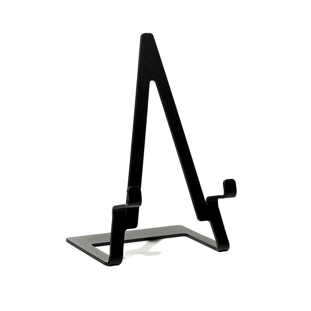 A minimalist display easel featuring one-piece steel construction and a durable powder-coated matte black finish. Designed in-house by Motawi Tileworks specifically for their unframed tiles. Size: 7" tall x 3" wide Specifically designed for tiles 4" and larger - perfect for taller tiles - will not accommodate a frame.