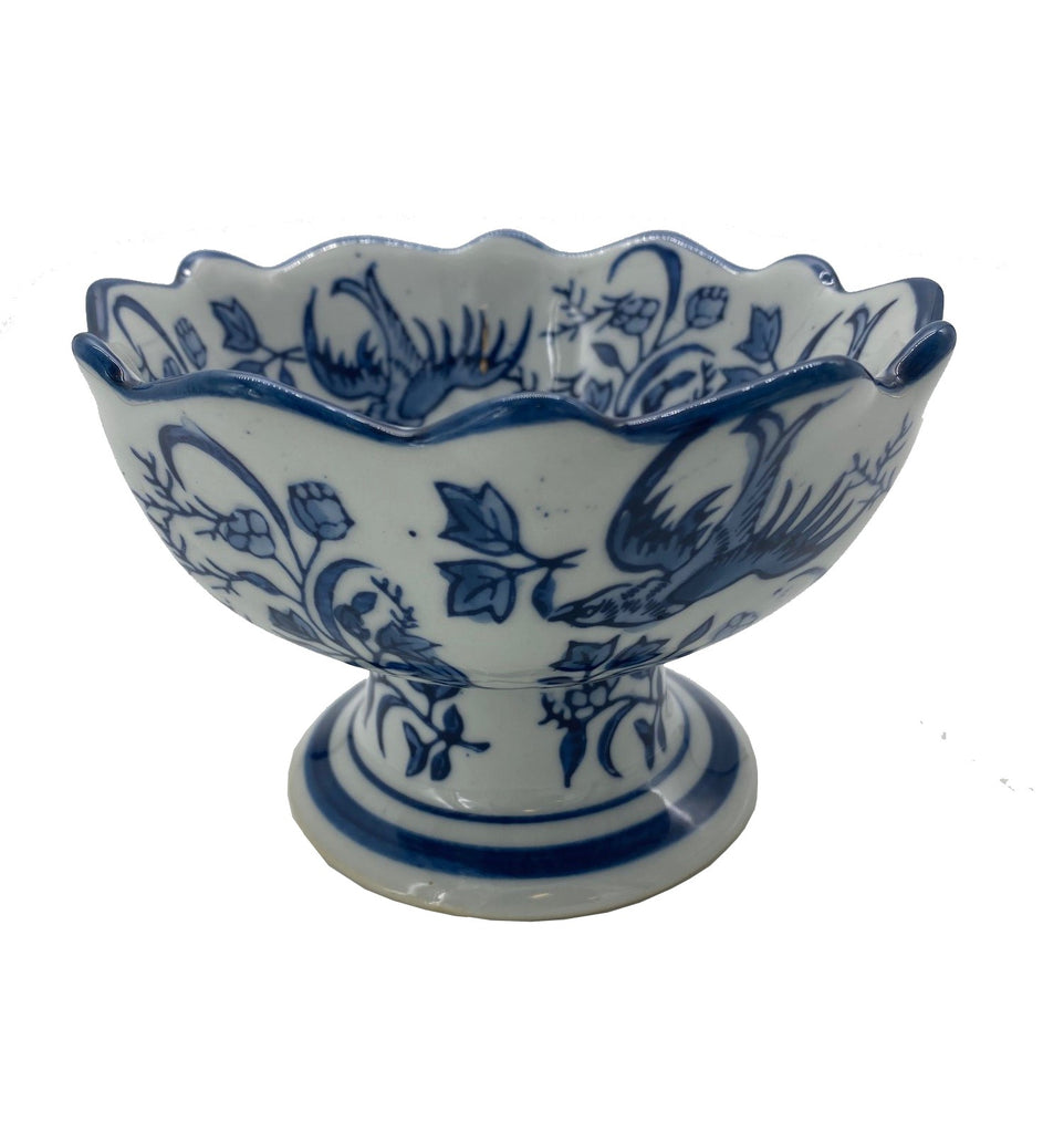 Inspired by designs from the ancient Ming and Qing dynasties, lotus flowers are hand-painted with intricate details and a soothing blue palette on this all purpose bowl. From tabletop to dècor this bowl is sure to dress up any table in style. Porcelain - Hand painted Size: 3 1/2" H x 5 1/2" Dia.