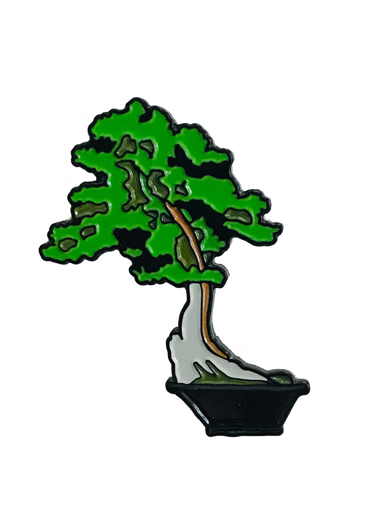 Enamel pin inspired by the California juniper (Juniperus californica), bunjin (literati or abstract style) bonsai, 500 years old. Displayed in Tokoname pot from Japan in The Huntington Bonsai Collection. Original photo by Andrew Mitchell. Size approx 1.5" x 1" Exclusive to The Huntington Store.
