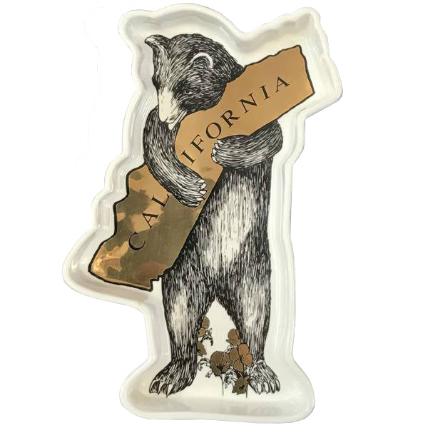 The bear artwork on this handy trinket dish is based on vintage art from the 1913 sheet music cover of California's state song. Durable stoneware trinket tray measures 7.25" x 5" x 1" deep. Great tray for jewelry/change as well as food safe for serving small treats. Ceramic. Dishwasher safe. Size: 7" x 4" x 1".