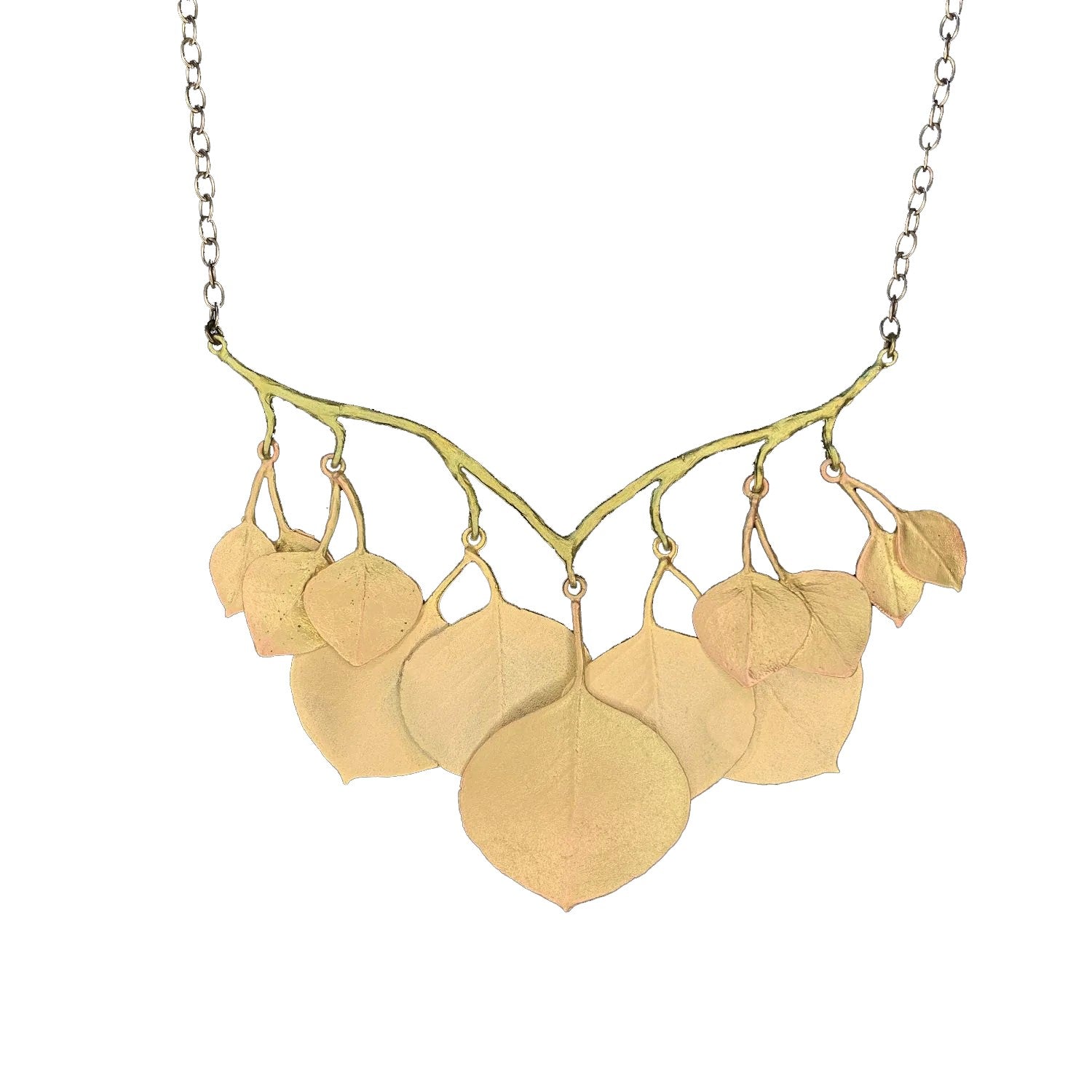 This eucalyptus necklace is cast in bronze with 24kt gold plated leaves and hand patinated branches. A number of leaves also feature soft copper highlights. Measures: 17" - 19" L (adjustable); Branch: 2.98" L x 3.43" W Hand made in the USA by Michael Michaud.