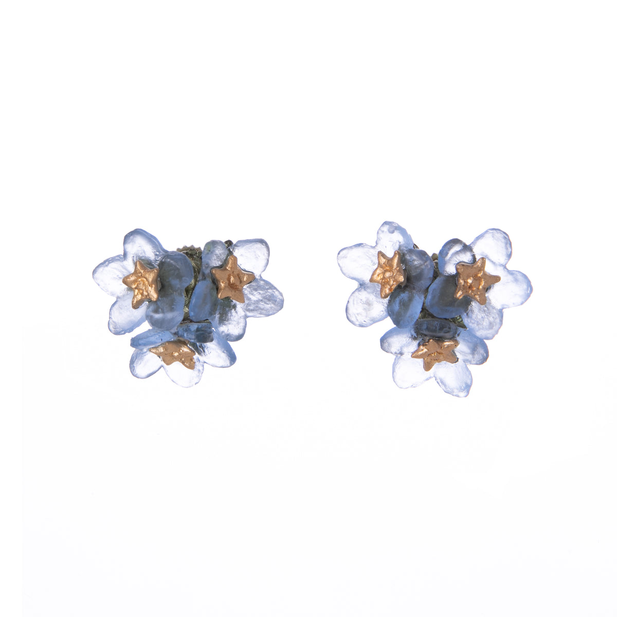 The forget-me-not has a rich history and holds deep meaning; it has long been a symbol of remembrance and true love. Add a touch of romance to your outfit with this delicate trio of forget-me-not blooms. Crafted from cast bronze and handmade glass. Hand finished Cast bronze and glass Post fastening Size: 0.5&quot; x 0.5&quot;