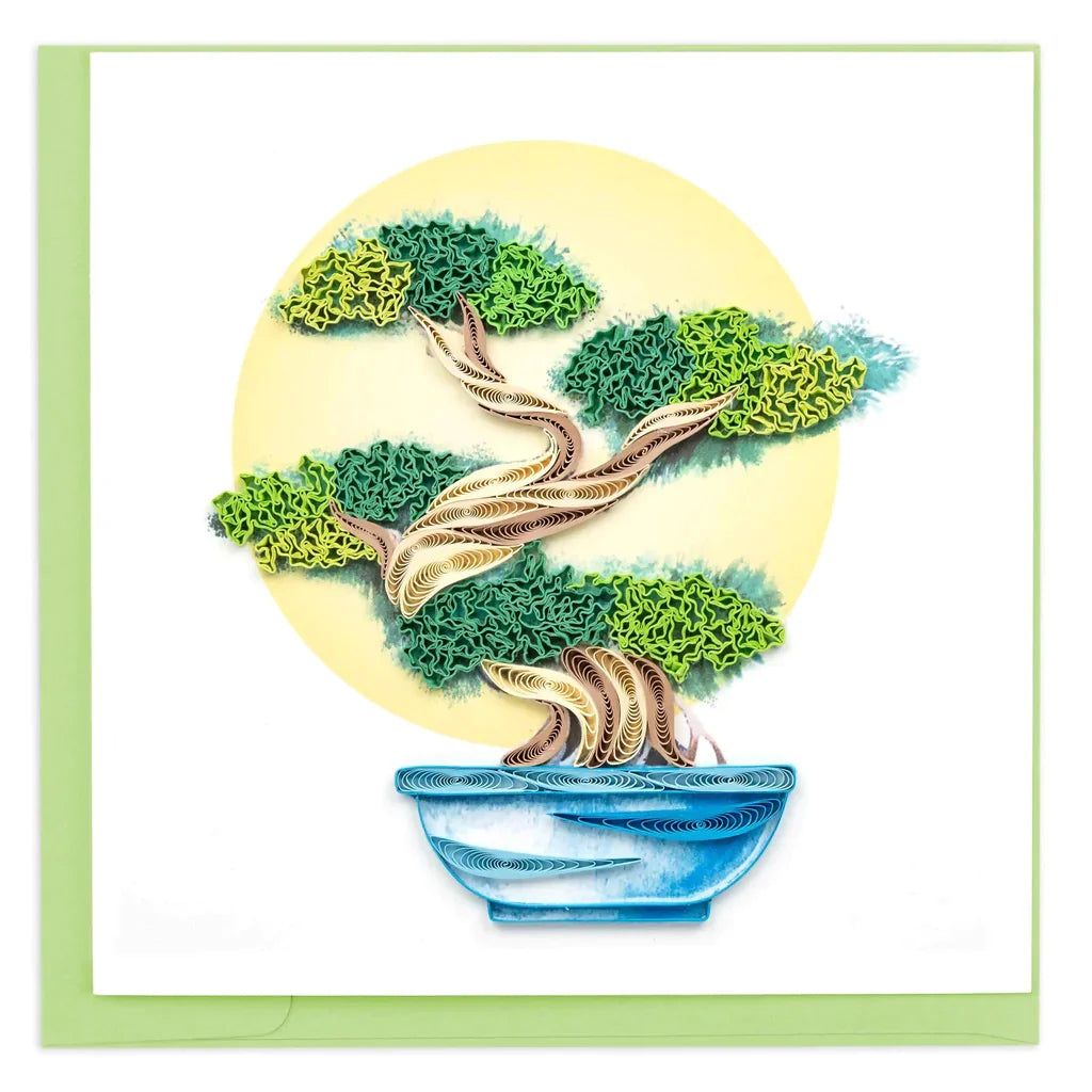 This show-stopping note card features a beautiful bonsai tree, made entirely of intricately quilled paper. Each quilled card is beautifully handmade by a highly skilled artisan and takes one hour to create. Size: 6" x 6" Includes mint green envelope.