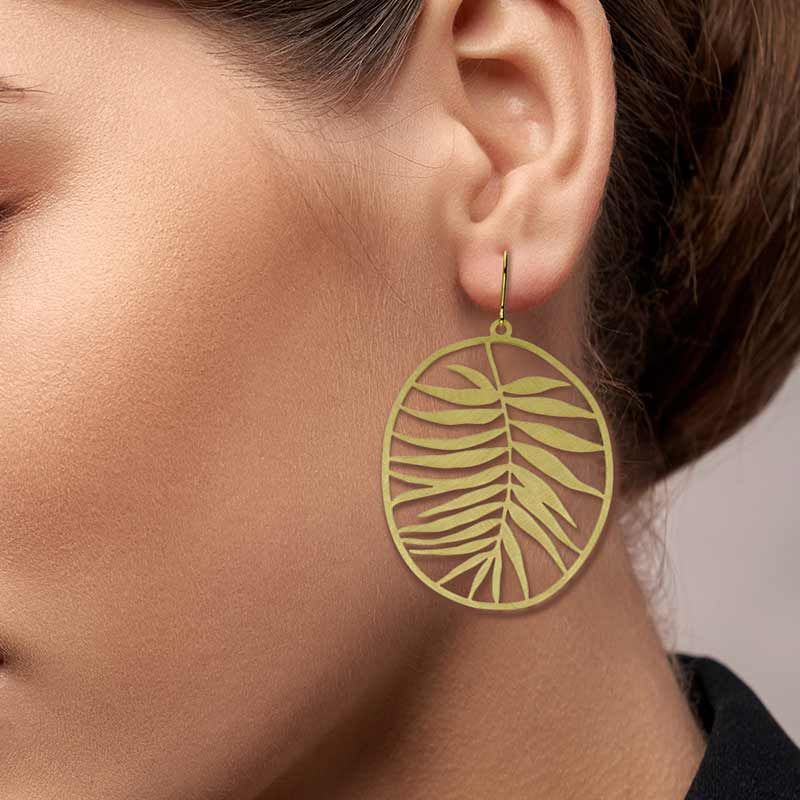 Add a touch of tropical elegance with these statement leaf earrings. Light enough to wear all day, or to add interest to an evening ensemble. Material: brass with brushed gold finish Gold plated brass ear-wires Size: 1.69" x 2.79" Made in Spain. Matching necklace and pin available.