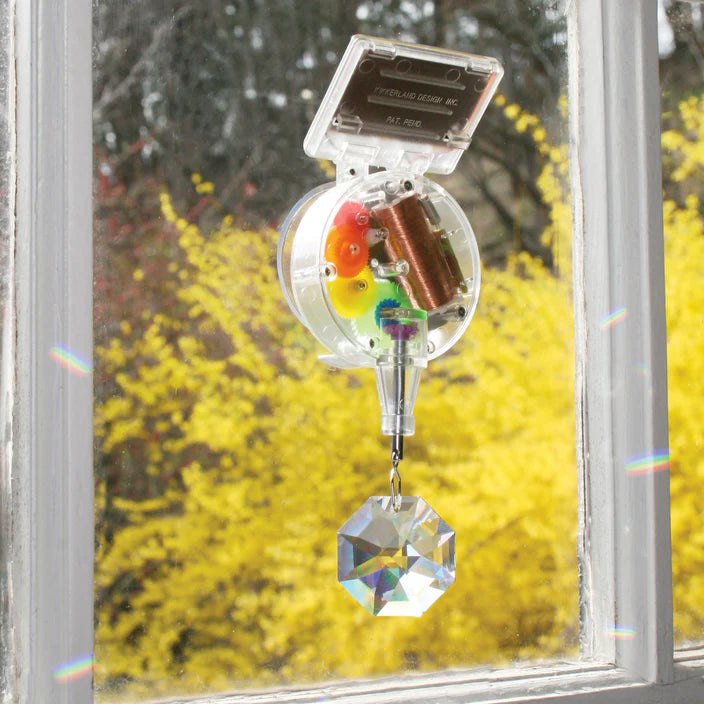 Create your own rainbow with the Solar-Powered Rainbow Maker. With Genuine Crystal! It attaches easily to your window and creates an explosion of rainbow patterns when the sun hits it. Place in direct sunlight and adjust the position as the season's change to maximize the effect. W-2" x H-5.5" x L-1.5".