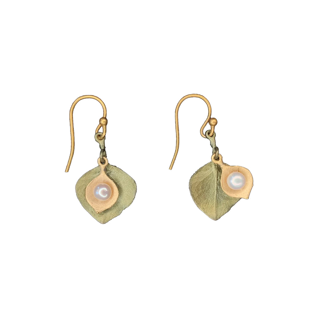 These beautifully delicate eucalyptus leaf earrings are cast in bronze with a subtle green patina and a 24kt gold plating, accented with white freshwater pearls. The wires are 24kt gold plated 925 Sterling silver. Size 0.85" L x 0.56" W Bronze with 24kt gold plating. Freshwater pearl accents. Gold plated ear wires.