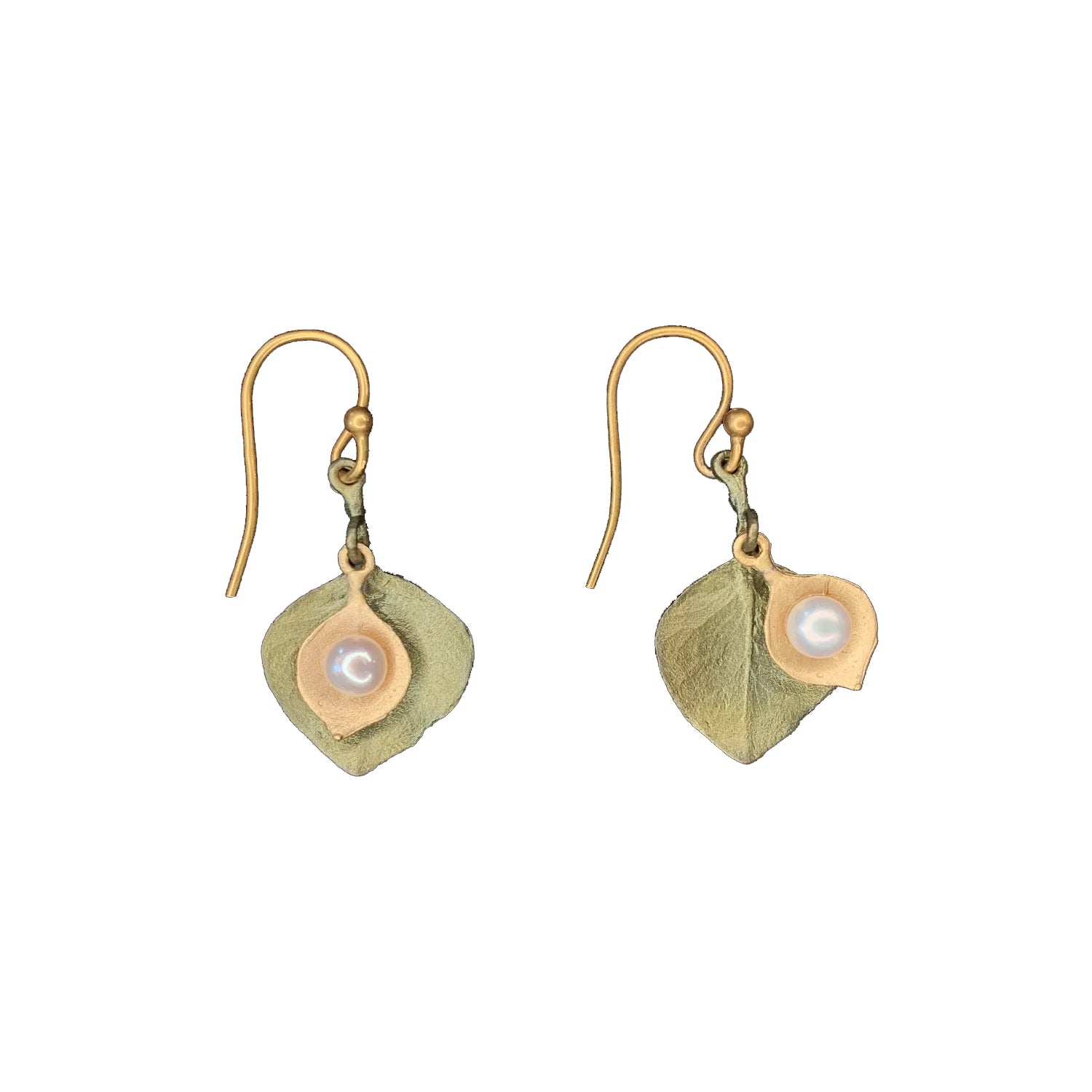 These beautifully delicate eucalyptus leaf earrings are cast in bronze with a subtle green patina and a 24kt gold plating, accented with white freshwater pearls. The wires are 24kt gold plated 925 Sterling silver. Size 0.85" L x 0.56" W Bronze with 24kt gold plating. Freshwater pearl accents. Gold plated ear wires.