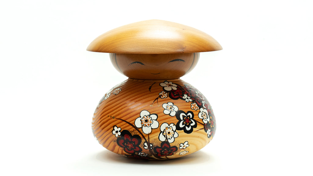 Kokeshi are believed to bring prosperity and joy to any space they occupy and also lend a sense of safety to their households. Each one of these Kokeshi dolls is unique, one-of-a-kind, and is given special attention to detail. Hand-carved Hand-painted 8" high x 6" wide